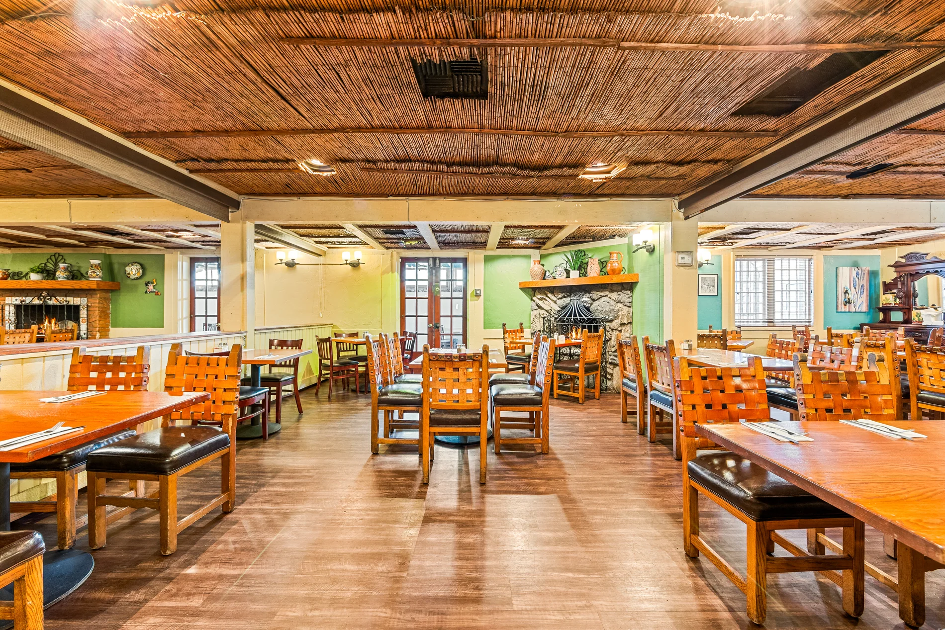 A banquet room with long tables set for a gathering
